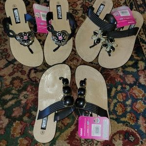 Lot of black ornate sandals